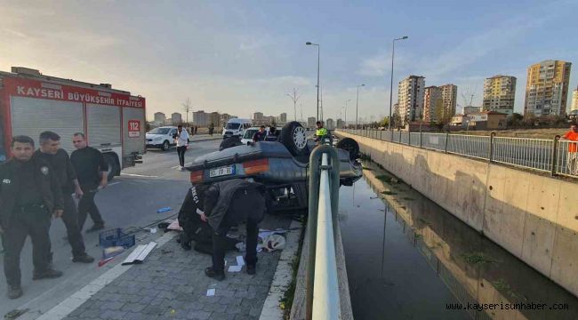 Takla atan otomobil kanala düşmeden son anda durdu: 1 yaralı